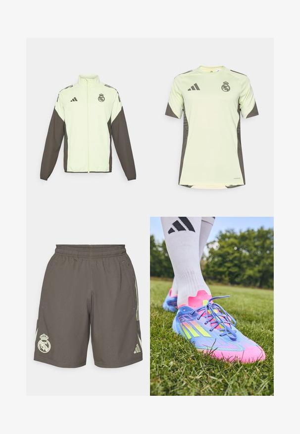 Adidas-jakke med en lys grønn kropp og mørkebrune ermer. Den har en høy krage, frontglidelås og logo på brystet.; Lys grøn kortermet jersey med mørkegrå detaljer, prydet med lagets logo på brystet, laget av pustende materiale med fukttransporterende teknologi.; Grå treningsshorts med elastisk midje, lys grønne side-striper og en hvit Real Madrid-logo på venstre kant.; Adidas fotballsko i blått, rosa og neongul; teksturert syntetisk overdel, buet design, flate lisser og koniske knagger for grep.