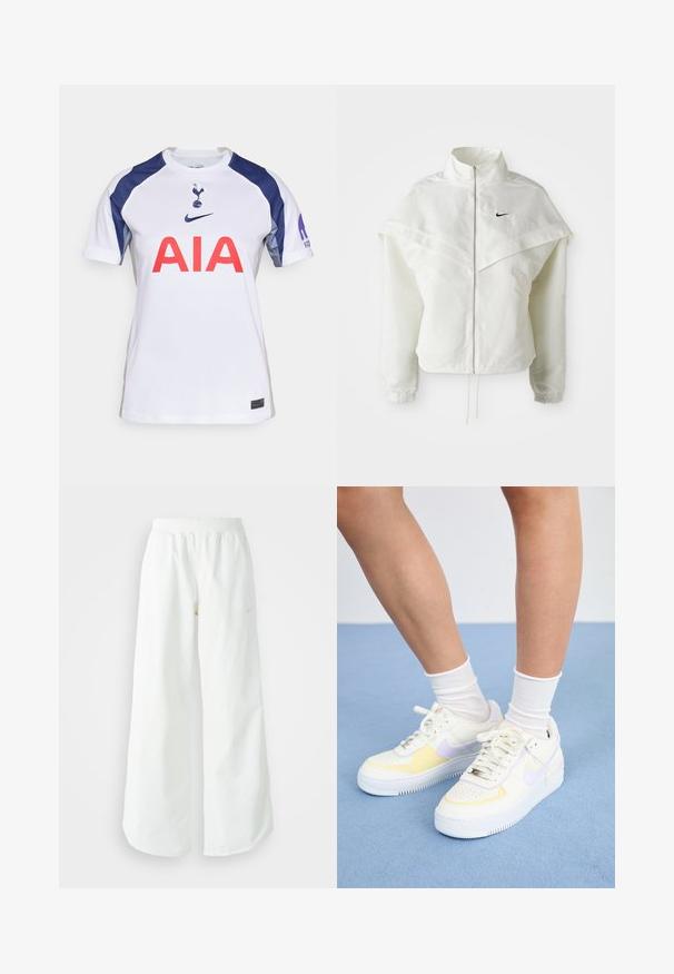 Bjela jakna dugih rukava s patentnim zatvaračem i visokim ovratnikom, s kapastim detaljima preko ramena, elastičnim manžetama i malim crnim Nike logom na prsima.; Bijela kratkotrajna nogometna majica s plavim detaljima, s okruglim izrezom, velikim crvenim logotipom "AIA" i grbom momčadi na prsima.; Bijele široke sportske hlače s rebrastim pojasom i suptilnim logotipom. Glatka tkanina s opuštenim krojem i suženim rubom.; Bijele kožne tenisice s žutim i lavandinim naglascima, okrugli vrh, ravne vezice i teksturirana gumena potplat. Nosene s bijelim čarapama.