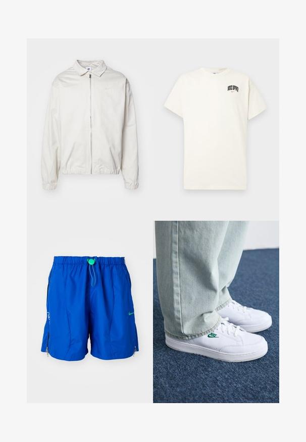 Giacca Nike bianca, leggera, con colletto, zip frontale, polsini elasticizzati e un piccolo logo sul lato sinistro del petto. Texture liscia.; T-shirt in cotone color crema con maniche corte, con la scritta "NIKE SB" in nero e rosso sul petto. Collo tondo standard.; Shorts da nuoto atletici blu con cintura elastica e cordino regolabile. Dotati di tasche con zip e un accento con logo sulla parte anteriore.; Sneakers in pelle bianca con logo Nike verde, punta rotonda, suola piatta, abbinati a pantaloni in denim azzurro, mostrati su un tappeto blu.