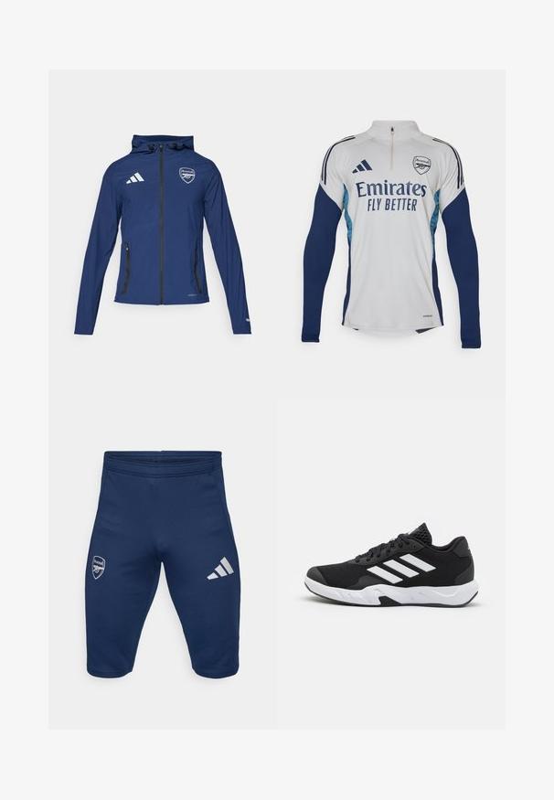Námořnická voděodolná bunda s předním zipem, kapucí, logem Adidas, znakem Arsenalu a černými kapsami na zip. Lehká tkanina, hladká textura.; Bílý dlouhý rukáv dres s námořnickými modrými akcenty, polo-zip výstřih, se štítkem "Emirates Fly Better" a znakem klubu Arsenal.; Námořnické sportovní šortky vyrobené z pružné látky, s logem Arsenalu na levé noze a třemi bílými pruhy Adidas na pravé noze.; Černé sportovní boty s texturovaným síťovaným svrškem, bílými akcentními pruhy, polstrovanou podrážkou a vyztuženým patem pro podporu.
