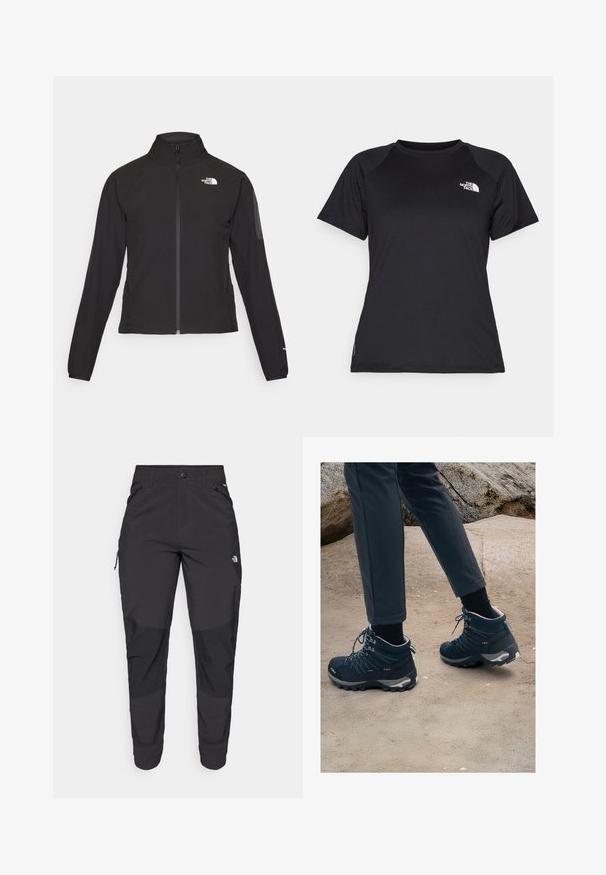 Schwarze Zip-Jacke mit hohem Kragen, strukturiertem Stoff und Logo auf der linken Brust. Verfügt über lange Ärmel und eine taillierte Passform.; Schwarzes, kurzärmliges Sport-T-Shirt mit Rundhalsausschnitt und dem The North Face-Logo auf der oberen linken Brust.; Schwarze Outdoor-Hosen aus strapazierfähigem Material. Verfügen über Reißverschlusstaschen, verstärkte Knieeinsätze und ein gerades Design für Beweglichkeit.; Dunkelblaue Wanderschuhe mit strukturiertem Mesh, Schnürsenkeln und Gummisohlen, kombiniert mit dunklen Hosen, vor einem sandigen, felsigen Hintergrund.