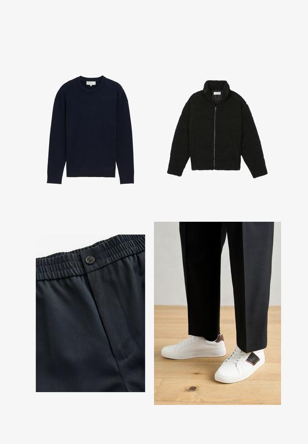 Črna jakna iz umetnega krzna z visokim ovratnikom, z zadrgo, elastičnimi manšetami in kviltanim dizajnom. Ima stranske žepke in mehak tekstur.; Mornarsko modra dolg rokav pulover s rebrastim okroglim izrezom in manšetami, prikazan na eni sami beli podlagi.; Mornarsko modra, lahka tkanina z gladko teksturo. Ima elastičen pas z gumbom in enostransko žep.; Beli športni copati z gladko teksturo, okrašeni z rjavimi usnjenimi detajli in črnimi poudarki, v kombinaciji s črnimi krojenimi hlačami. Ozadje iz lesenih tal.