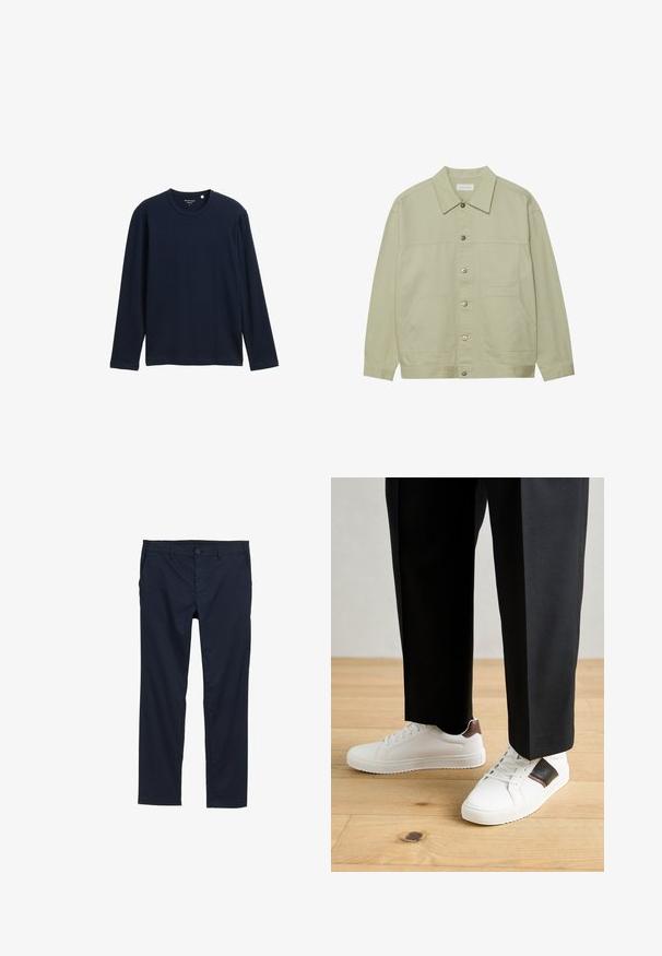 Világos zöld, gombos dzseki pamutból. Két elülső foltvarrásos zseb és klasszikus gallér jellemzi. Texturált anyag, sima felülettel.; Sötétkék, hosszú ujjú póló, puha pamutból készült, kerek nyakkivágással és laza szabással, látható minták vagy díszítések nélkül.; Sötétkék, könnyű nadrág sima textúrával, egyenes szárú dizájnnal, gombos záródással és oldalsó zsebekkel.; Fehér sneaker, sima textúrával, barna bőr díszítéssel és fekete részletekkel, fekete szabott nadrággal párosítva. Fából készült padló háttér.