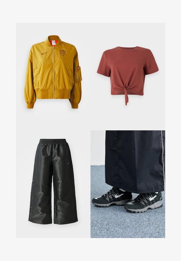 Keltainen pommikaukopuku, jossa on joustavat hihansuut ja helma, etuvetoketju, sivutaskut ja logo yksityiskohtana rinnassa.; Rusto-sävyinen lyhythihainen crop-top, joka on valmistettu pehmeästä puuvillasta ja jossa on solmittu etuosa. Sujuva pinta, pyöreä pääntie.; Mustat urheiluhaut, joissa on kiiltävä ja sileä kangas, elastinen vyötärö, leveät lahkeet ja pieni logo vasemmalla puolella.; Mustat urheilukengät, joissa on teksturoitu päällinen, hopeiset yksityiskohdat ja kuvioitu ulkopohja, yhdistettynä mustaan pitkään vaatteeseen. Taustalla sininen matto.