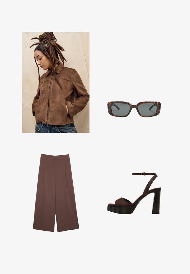 Mlada osoba s dugim smešnim dredovima stoji naslonjena na svijetli drveni zid, noseći smeđi antilop jaknu i plave traperice, s rukama u džepovima i glavom nagnutom prema dolje.; Smeđi kratki rukav majica od mekog materijala, s okruglim izrezom i opuštenim krojem. Nema vidljivih uzoraka ili naglasaka.; Smeđe hlače širokog kroja s glatkom teksturom, koje imaju visok struk i nabore sprijeda. Tkanina je lagana i slobodno se kreće.; Smeđe zamšaste sandale s visokim potpeticama, otvorenim prstima, podesivom trakicom oko gležnja i prugastom platformom.; Smešane sunčane naočale s pravokutnim lećama, debelim okvirom i tamnim lećama. Glatka tekstura i minimalistički dizajn.