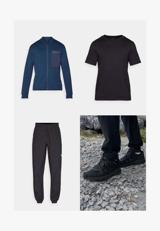 Marineblaue Zip-Jacke aus weichem Stoff, mit Stehkragen, langen Ärmeln und einer aufgesetzten Tasche mit Logo auf der linken Brust.; Schwarzes T-Shirt aus glattem Stoff mit Rundhalsausschnitt und kurzen Ärmeln. Dezente Markenlogo-Druck in Schwarz auf der Brust.; Schwarze Sporthosen aus leichtem Stoff, mit einem Kordelzugbund, seitlichen Taschen und schmal zulaufenden Bündchen an den Knöcheln.; Schwarze Outdoor-Schuhe aus Mesh und synthetischem Material, mit einer strukturierten Oberseite, gesichertem Schnürsystem und griffiger Laufsohle, auf felsigem Gelände.