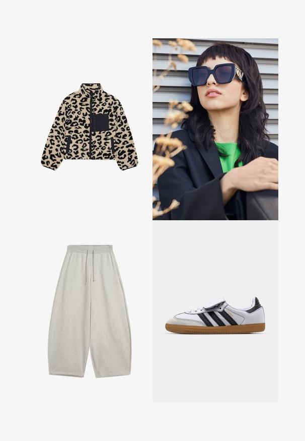 Leopárdmintás bolyhos dzseki bézs és fekete színben. Cipzáros záródással, magas gallérral és fekete mellzsebbel rendelkezik. Puha tapintású, laza fazonú.; Csíkos pulóver fekete és szürke színben, az egyik vállról lelógó fazonban, a mellrészen feltűnő, fehér "92" printtel. Puha tapintás, felhajtott ujjak.; Világosszürke, bő szárú melegítőnadrág, elasztikus derékpánttal és húzózsinórral, oldalsó zsebekkel és laza szabással.; Fehér bőr sportcipő fekete csíkokkal és szürke részletekkel, lekerekített orral és gumi talppal. Téglányszíj és fűzős záródás.; Túlméretezett fekete napszemüveg vastag kerettel és arany díszítéssel, fekete blézerral és élénk zöld inggel viselve, vízszintes háttér előtt.