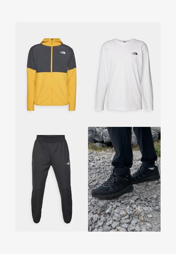 Žlutá a šedá mikina na zip s kapucí, s texturovanou horní částí, hladkou spodní částí a bočními kapsami. Logo značky na hrudi.; Bílý dlouhý rukáv tričko vyrobené z bavlny s kulatým výstřihem. Na hrudi se nachází malé černé logo. Hladká textura, běžný střih.; Černé tepláky s nastavitelným pasem, zúženým střihem, elastickými manžetami a malým bílým logem na levém stehně, vyrobené z hladké tkaniny.; Černé venkovní boty z prodyšného a syntetického materiálu, s texturovaným svrškem, bezpečným šněrovacím systémem a robustní podrážkou, na skalnatém terénu.