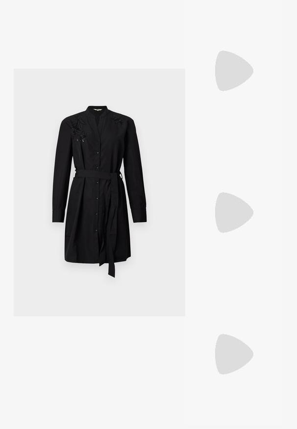 Black shirt dress made of smooth fabric, featuring a button-up front, long sleeves, a waist tie, and beaded floral embellishments on shoulders.; Black leather high-heeled platform loafers with a rounded toe and a decorative strap. The heel features a textured silver accent.; Silver metallic pouch bag with a soft, rounded shape and a knotted top closure. Made from smooth faux leather material.; Silver hoop earrings with a twisted design, featuring a polished finish and post-back closure. Measure approximately 3 cm in diameter.