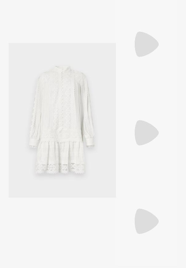 White dress with long sleeves and a high collar. Features intricate lace patterns, textured fabric, and a layered hem. Button closure at front.; Pointed-toe pump in light beige leather, featuring a low heel, smooth surface, and minimalist design with a subtle back detail.; Beige leather handbag with a rectangular shape, featuring a gold-tone clasp closure and a detachable strap, worn with blue denim jacket.; Gold hoop earrings with a smooth, shiny finish. Circular design featuring a small post and clear backing for secure wear.