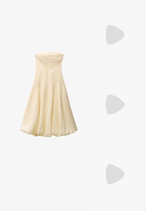 Krema boje bez naramenica sa uskim korzetom i lepršavom suknjom. Napravljena od glatkog, laganog materijala, sa vertikalnim šavovima.; Cipele s potpeticom u boji kože, s čvorastim prednjim dijelom ukrašenim rhinestones detaljima i tankim remenom oko gležnja s kvadratnom kopčom.; Zlatne metalne sunčane naočale sa četvrtastim okvirom, smešnim gradijentnim staklima i šarama kornjačevine na drškama. Lagani dizajn.; Zlatne naušnice organskog, zrnastog oblika s glatkom, reflektirajućom površinom; imaju minimalistički dizajn bez vidljivih dijelova.