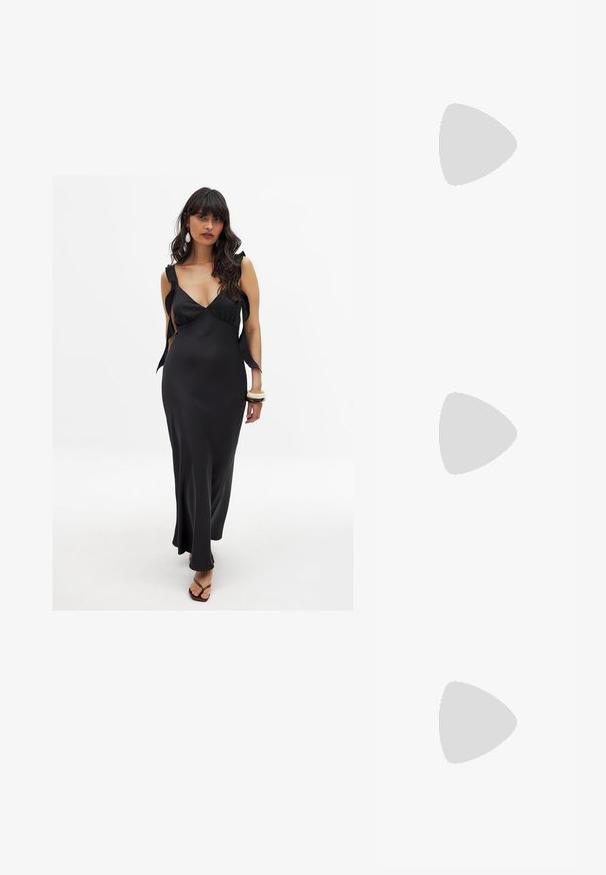 Vestido de satén negro con escote pronunciado, tirantes anchos atados en los hombros y una larga silueta fluida que acentúa la figura.; Tacones slingback de charol negro con punta afilada, tacón de aguja bajo y un diseño elegante y simple sin adornos.; Gafas de sol negras en forma de ojo de gato con un acabado mate, que presentan lentes ahumados grises, ángulos pronunciados y brazos laterales elegantes. Nombre de la marca visible en el interior del brazo.; Clutch metálico dorado con una forma suave y redondeada, que presenta un cierre de botón en la parte superior y una pequeña correa de cadena para llevar.