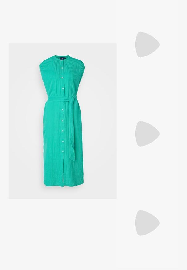 Gap Tall TIE WAIST DOWN MIDI - Kreklkleita - simply green; Beige augstiem papēžiem ar bloku, ar siksniņu dizainu un regulējamu potītes siksniņu, izgatavoti no gludas sintētiskas materiāla ar matētu apdari.; Brūnas bruņurupuču čuguna brilles ar ovālām lēcām, plānām kājām un caurspīdīgām akcentiem. Uz tempļa ir smalka logo. Sleek, viegla konstrukcija.; Brūns ādas plecu soma ar izliekta formu, zelta piederumiem un sprādzes akcentu. Iesaiņota ar noņemamu plecu siksnu.