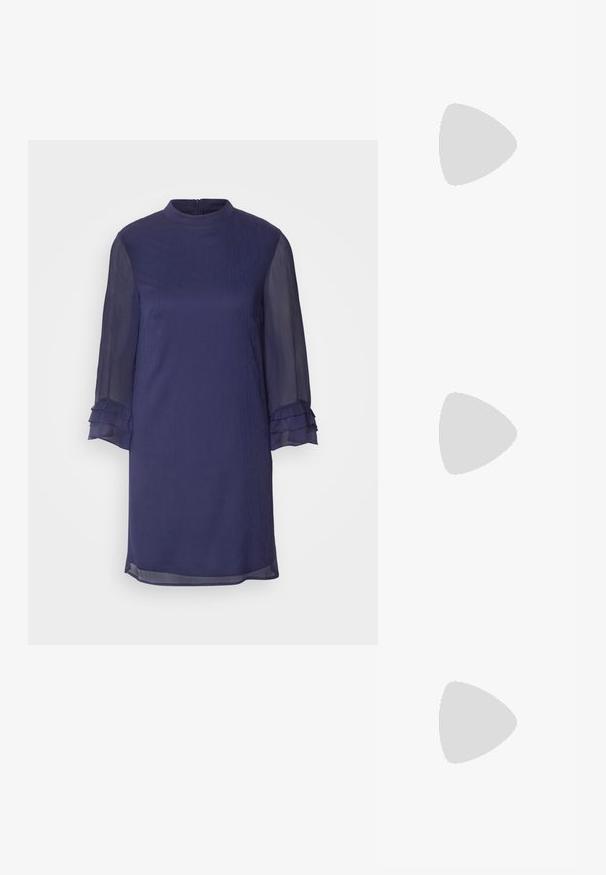 Navy blue dress with a high neckline, long sheer sleeves featuring ruffles, and a straight cut. Smooth fabric texture, above-knee length.; White slingback heel with a pointed toe, smooth upper material, low block heel, and side cut-out design with adjustable buckle strap.; Hexagonal sunglasses with brown gradient lenses, transparent beige frame, and dark brown arms. Features "vogue" branding on the side.; Michael Kors wristlet in beige coated canvas featuring a repeating MK logo pattern, gold hardware, and a detachable chain strap.