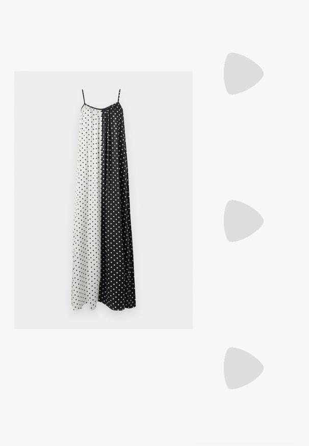 Mouwloze, lange jurk met een splitontwerp in zwart-witte secties, elk versierd met kleine stippen. Lichtgewicht stof.; Lichte beige top met een ronde halslijn, asymmetrische zoom en geplooide details aan één kant. Gemaakt van een zachte, gestructureerde stof.; Zwarte flip-flop met een gestructureerde rubberen zool, twee slanke banden en een subtiele, ingedrukte logo-detail op de band.; Zwarte ovale zonnebril met donkere glazen en een glanzend kunststof frame. Heeft een gouden logo op de poot, dat een strakke en moderne uitstraling biedt.