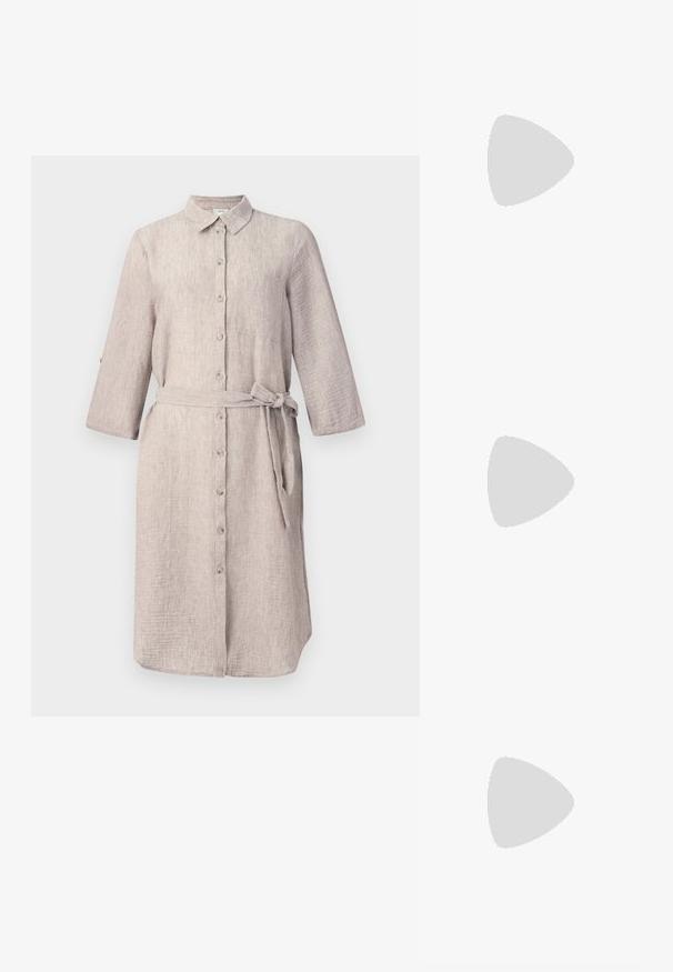 Light beige linen shirt dress with a collar, long sleeves, button-down front, and a matching belt. Features a single chest pocket.; Black patent leather slingback shoe with pointed toe, ankle straps featuring silver buckles and hardware, and a slender heel.; Gold metallic handbag with a structured design, smooth texture, and adjustable strap. Features a unique triangular shape and minimalist stitching.; Gold-tone earrings featuring textured, wavy shapes. Includes sculptural clip-on studs and open hoop design with a hammered finish.