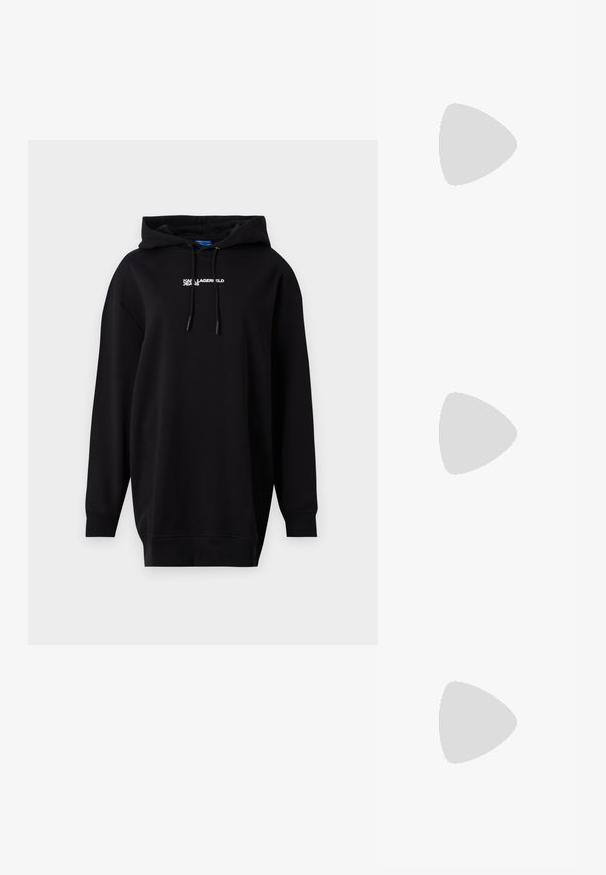Black hoodie made of cotton blend, featuring a kangaroo pocket, long sleeves, drawstring hood, and white logo text on the front.; Black leather high heel shoe with a pointed toe, smooth texture, and a tapered heel. Minimalist design, no additional embellishments.; Black leather shoulder bag with a soft texture, triangular shape, and adjustable strap, paired with a light blue striped shirt and white pants.; Silver hoop earrings with a smooth, curved design. Features a shiny metallic finish and stud closure. No visible patterns or accents.