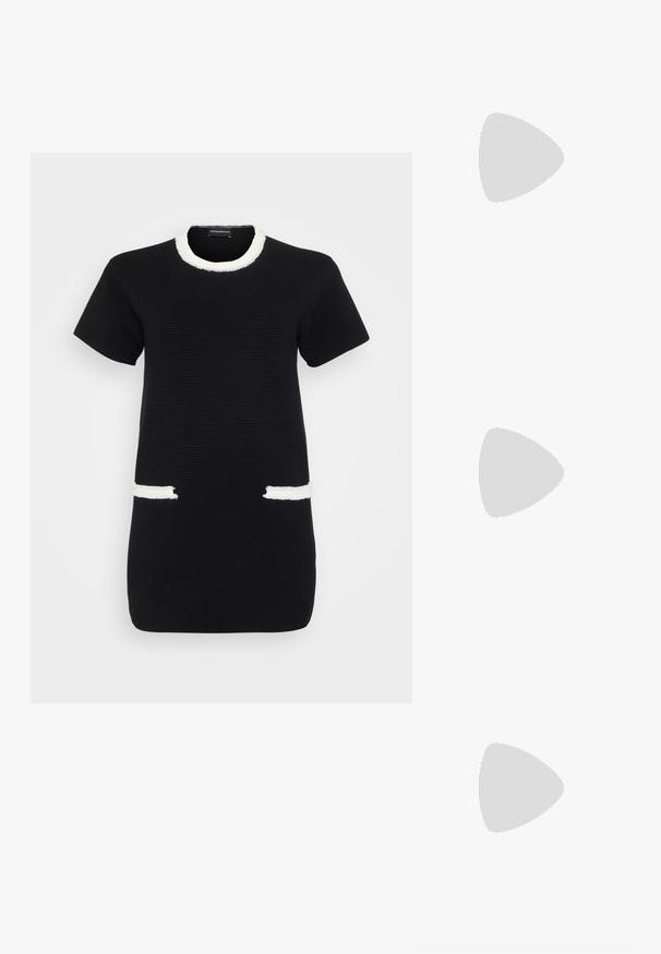 Black short-sleeve dress with textured fabric, white fringed neckline, and white fringed accents on front pockets.; White leather sneakers, low-top design, featuring a smooth texture, round toe, laced front, and a small embroidered logo on the side.; Black leather half-moon bag with a gold hardware accent, featuring a zip closure. Worn crossbody over a gray sweater.; Gold-tone knot stud earrings with a twisted design. Each earring features a circular clear backing for secure wear.