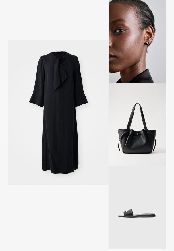 Crna midi haljina s uspravnim ovratnikom i detaljem kravate, dugim rukavima i opuštenim krojem, izrađena od glatkog materijala s mat završnom obradom.; Crne klizne sandale s širokim gornjim dijelom, glatkom kožnom teksturom, otvorenim prstima i zlatnim detaljem na remenu. Ravan đon.; Crna kožna torba za nošenje s dva dugačka remena, skupljenim vrhom i zlatnim okruglim detaljem. Glatka tekstura s minimalističkim dizajnom.; Zlatne cvjetne naušnice sa teksturiranim crnim središtem i delikatnim detaljima. Na profilu su vidljive modelove bistre kože i pletena kosa.