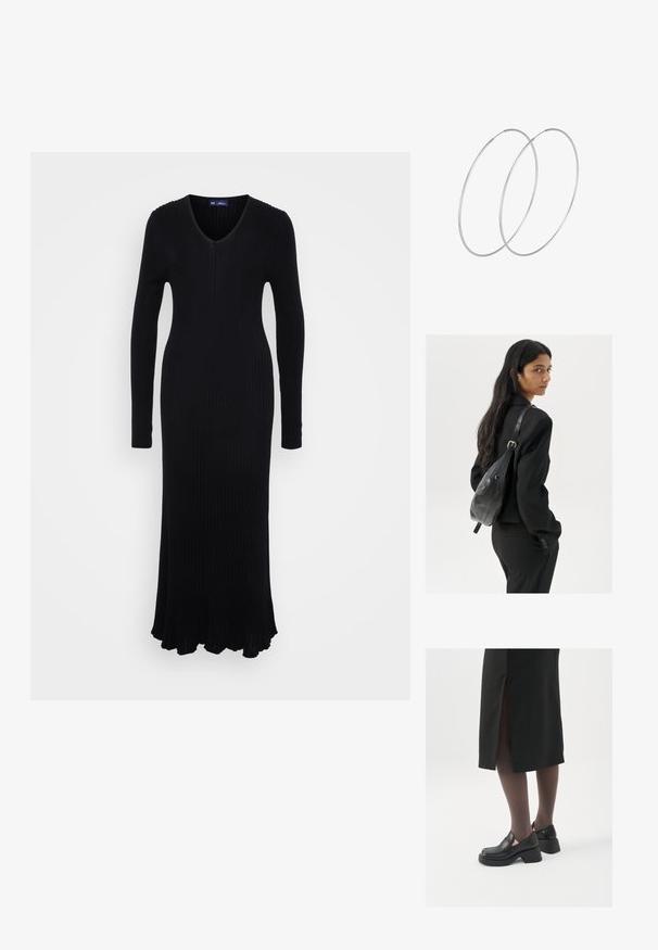 Abito a maglia nero a coste con maniche lunghe, scollatura a V e orlo svasato. Realizzato in un materiale elasticizzato per una silhouette aderente.; Scarpe in pelle nera con punta arrotondata, tacco spesso a blocco e accenti laterali in elastico, abbinate a collant scuri e una gonna nera con uno spacco.; Donna con lunghi capelli scuri, vestita con un completo nero, che porta una borsa a tracolla in pelle nera, mentre guarda oltre la spalla su uno sfondo bianco.; Orecchini a cerchio in argento con un design minimalista. Forma circolare, superficie liscia e profilo sottile. Leggeri con una finitura lucida.