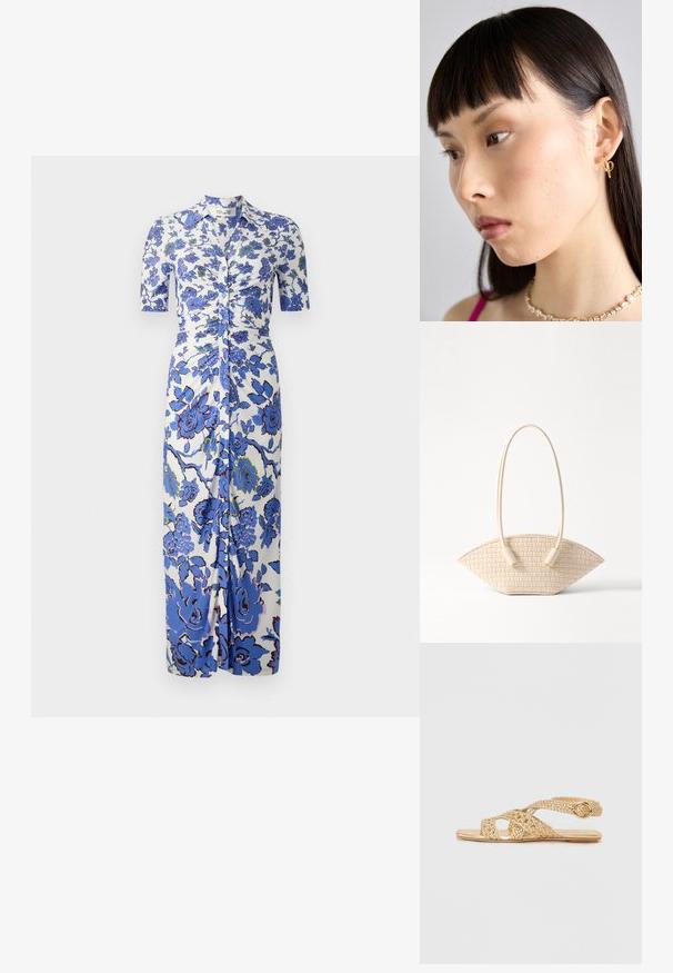 Kwiatowa sukienka z białym tłem i niebieskimi kwiatami, krótkimi rękawami, zapięciem na guziki z przodu oraz marszczeniami w talii.; Stuart Weitzman THEA złoty; Woven beżowa torebka o unikalnym zakrzywionym kształcie, z dwiema teksturowanymi uchwytami i cylindrycznymi akcentami metalowymi.; Złoty kolczyk w kształcie obrączki noszony w prawym uchu, z otwartym wzornictwem. Modelka ma proste, ciemne włosy i minimalny makijaż.