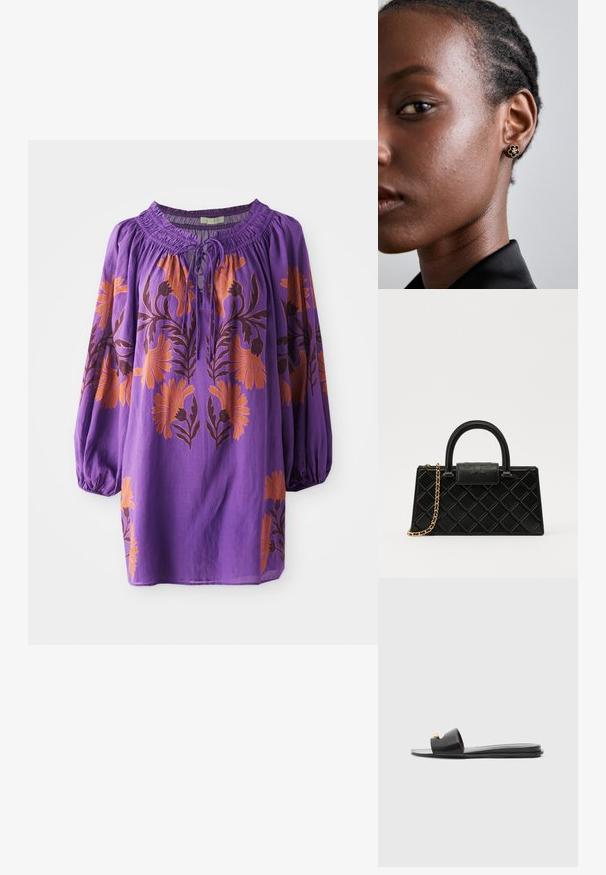 Lila Bluse mit gerafftem Ausschnitt, langen Ballonärmeln und orangefarbenem Blumenstickerei. Leichter Stoff mit fließender Textur.; Schwarze Rutschen mit breiter Oberseite, glattem Ledertextur, Offenen Zehen-Design und goldenen Akzenten am Riemen. Flache Sohle.; Schwarze Handtasche aus strukturiertem Leder mit einem Diamantmuster, goldfarbener Kette, einem oberen Griff und einem Logo-Prägung Klappenverschluss.; Die goldenen Blumensteckerohrringe haben ein strukturiertes schwarzes Zentrum und zarte Verzierungen. Die klare Haut und die geflochtenen Haare des Modells sind profilseitig sichtbar.