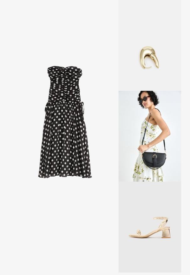 Czarna sukienka bez ramiączek w białe kropki, marszczony gorset i zwiewna spódnica. Posiada sznurki po bokach do regulacji dopasowania. Lekki materiał.; Złote metaliczne sandały na obcasie z kanciastym blokowym obcasem, z dwiema paskami na stopie i regulowanym paskiem wokół kostki. Gładka tekstura.; Czarna skórzana torebka o zakrzywionym kształcie, z odpinanym paskiem i złotymi akcentami. Torebka posiada klapę z zapięciem w kształcie klamry.; Złote metalowe kolczyki o eleganckim, zakrzywionym kształcie. Posiadają charakterystyczny szpiczasty kształt, polerowaną powierzchnię oraz zapięcie na zawias.