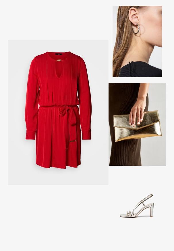 Red dress with a keyhole neckline, long sleeves, pleated design, and a matching tie belt at the waist. Made from a smooth fabric.; Metallic silver high-heel sandal with an open toe, featuring three thin straps across the foot and an ankle strap with a buckle.; Gold metallic clutch bag with a smooth texture, featuring a triangular flap closure. The hand holding it has neatly manicured nails.; Silver hoop earring with a polished finish, featuring small gold accent details and a round shape, worn on the lobe.