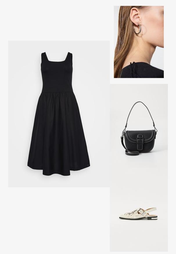 Zwarte jurk met een aansluitend ribgebreid lijfje en een uitlopende rok. Heeft een vierkante halslijn, brede schouderbanden en een zachte stofstructuur.; Slingback sandalen van wit leer met meerdere brede banden en zilveren gespen; platte zool met een kleine zwarte hak en metalen accenten.; Zwarte leren schoudertas met een gebogen ontwerp, opvallende sluiting met gesp en witte stiksels. Inclusief verstelbare schouderband.; Zilveren oorbel met een gepolijste afwerking, met kleine gouden accentdetails en een ronde vorm, gedragen op de oorlel.