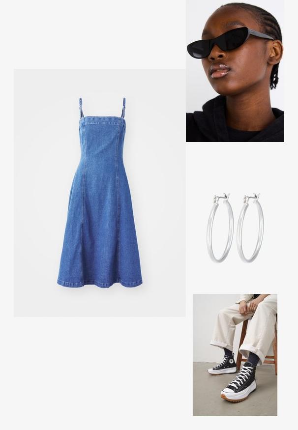 Denim obleka s prilegajočim se zgornjim delom, nastavljivimi naramnicami, razširjenim krilom, srednje modre barve in vidnimi šivi. Gladka tekstura.; Črne visoke tenisice z belimi vezalkami in gumijastim zaščitnim vrhom. Pogrnjen debel bel podplat z teksturiranim rjavim zunanjim podplatom, obute z mornarskimi črtastimi nogavicami.; Črne mačkaste sončna očala z mat površino, ki se ponašajo s prefinjenim dizajnom in rahlo ukrivljenimi robovi, nastavljene ob modelovih temnih oblačilih.; Srebrni obroči za ušesa z gladko, polirano površino. Okrogla oblika in varna zaponka s klikom. Lahka zasnova, primerna za vsakodnevno nošenje.