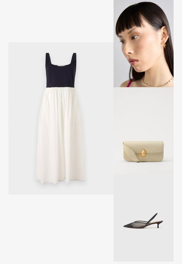 Tamsiai mėlyna be rankovių suknelė su kvadratine iškirpte, turinti baltą, surinktą sijoną. Pagaminta iš lengvo audinio, matomi siūlai apatinėje dalyje.; NEOUS IRENA - Klasikiniai aukštakulniai - black; Bežinė odinė rankinė su lygiu paviršiumi, stačiakampio formos ir auksiniu ovaliu užsegimu. Yra ilga, reguliuojama petneša.; Auksinė įvorės auskaras, dėvimas dešinėje ausyje, su atviru dizainu. Modelis turi tiesius tamsius plaukus ir minimalų makiažą.