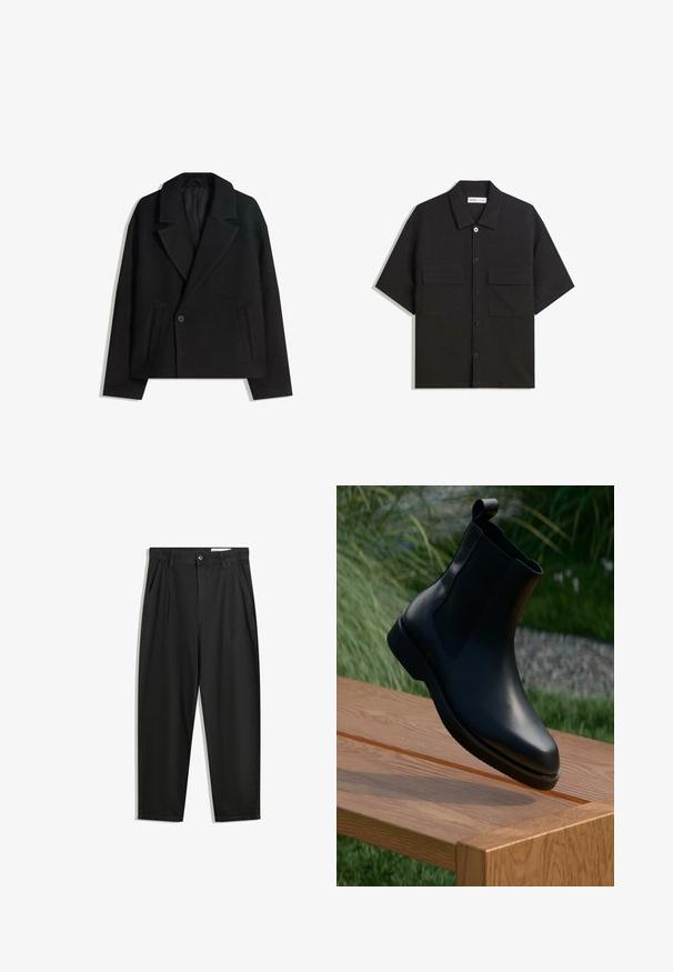 Črn brezčrtni dvojni plašč iz volnene mešanice z oblikovanimi reverji, dvema stranskima žepoma in enim gumbom. Mehka, teksturirana tkanina.; Črna kratkotrajna srajca iz tkanine z gladko teksturo, ima dve sprednji žepki, klasičen ovratnik in zapiranje na gumb.; Črne bombažne hlače s sproščenim krojem, ki vključujejo klasičen pas, sprednje gube in stranske žepke. Gladka tekstura brez vzorcev.; Črne usnjene gležnjarje s gladko površino, elastičnimi stranskimi paneli in zankastim trakom na gredi, postavljene na leseno površino.