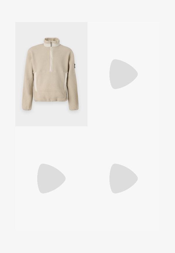 Beige fleece pullover with high collar, quarter-zip front, and two front pockets. Textured fabric with contrasting beige accents.; White cotton t-shirt featuring a colorful graphic of a group at a table, with red checkered tablecloths and text stating "WEEKEND OFFENDER."; Navy drawstring joggers with side pockets, tapered legs, and orange "WEEKEND OFFICER" text on the right thigh. Soft cotton blend material.; Brown and blue plaid wide-leg trousers paired with white shoes featuring black accents and textured soles, set against a green background.