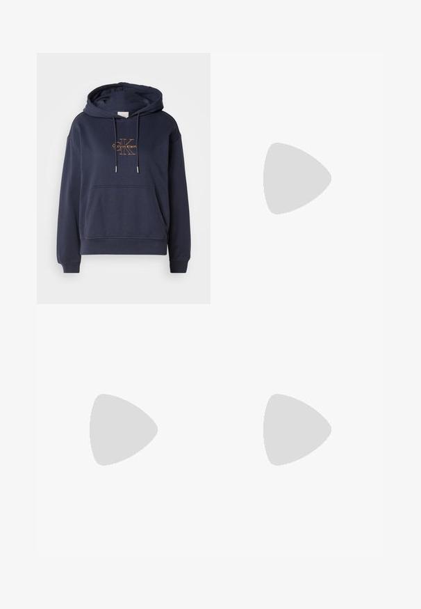 Navy blue cotton hoodie with a front pouch pocket, adjustable drawstrings, and a gold Calvin Klein logo printed on the chest.; Blue denim shirt featuring a classic collar, button-front closure, and long sleeves with a slightly loose fit. Faded wash and textured fabric.; Dark blue wide-leg jeans in denim fabric with a high waist, featuring orange stitching, five-pocket design, and a button closure.; White low-top sneaker with black heel tab, platform sole, laces, and Calvin Klein "CK" logo on the side.