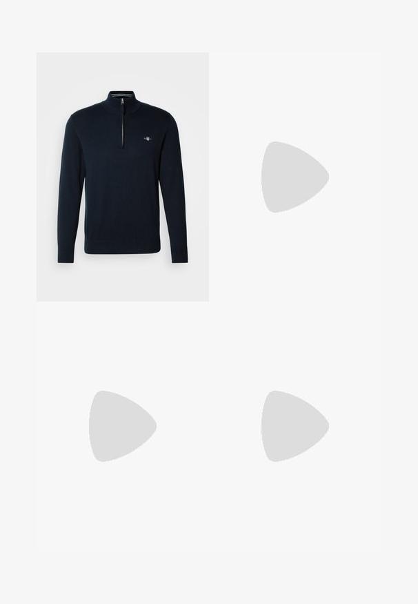 Pullover di maglia blu navy con colletto a mez zip, polsini a coste e piccolo logo ricamato sul petto. Tessuto liscio, vestibilità casual.; Camicia a maniche lunghe avanguardistica di colore blu navy realizzata in lino, con colletto a punta, pattina frontale e polsini. Presenta una texture sottile e un design leggero.; Chinos grigio scuro con fronte piatto, tasche laterali e chiusura con bottone. Tessuto di cotone liscio, design con gamba affusolata e stile minimalista.; Sneakers bianchi a punta bassa realizzati in pelle liscia. Presentano una tomaia blu navy sul tallone e un accento rosso sulla suola. Sei occhielli per i lacci.