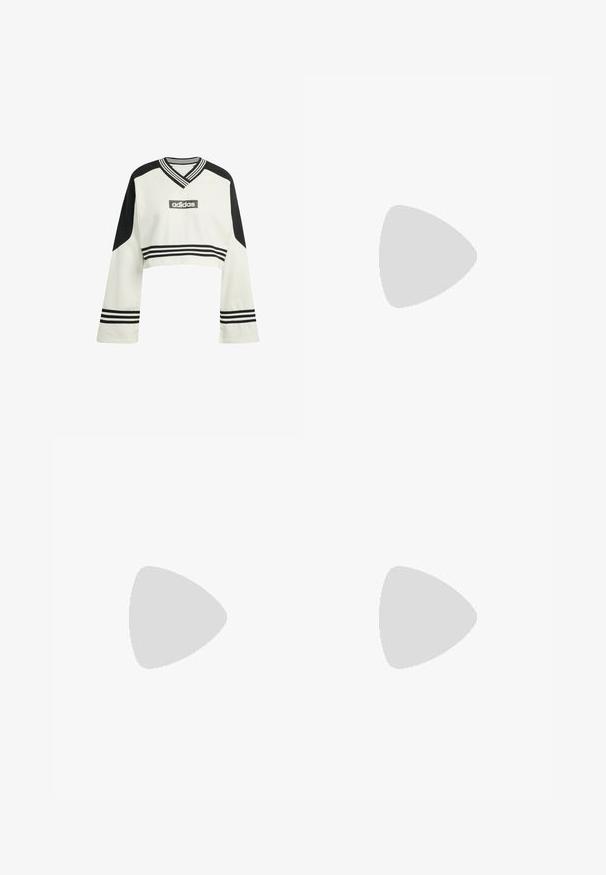 Felpa a maniche lunghe cropped color crema con accenti neri. Presenta un collo a V, polsini a righe e un logo Adidas ricamato sul petto.; Gonna nera al ginocchio con una cintura elastica, caratterizzata da una texture liscia e un design svasato che consente libertà di movimento.; Scarpa bianca con punta in suede rosa, strisce nere e una fascia in Velcro. Presenta una suola in gomma beige e un logo sul lato.; Occhiali da sole neri con lenti a sfumatura marrone; forma rettangolare con una montatura spessa, inclusi sottili dettagli metallici sulle astine.