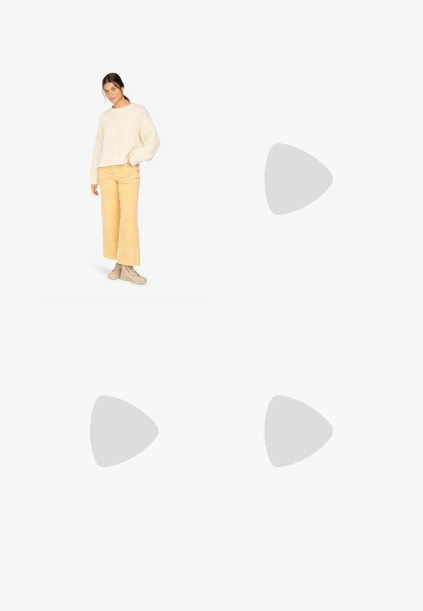 Cream knitted sweater with wide sleeves, paired with light yellow corduroy pants and beige lace-up boots. Simple and textured design.; Black faux leather shorts with an elastic waistband, featuring a smooth texture and loose-fitting design. No visible patterns or accents.; RAID CHERISH - Platform boots - black; Gold-tone twisted rings stacked together, featuring a textured design with smooth and curved edges, creating an organic, flowing appearance.