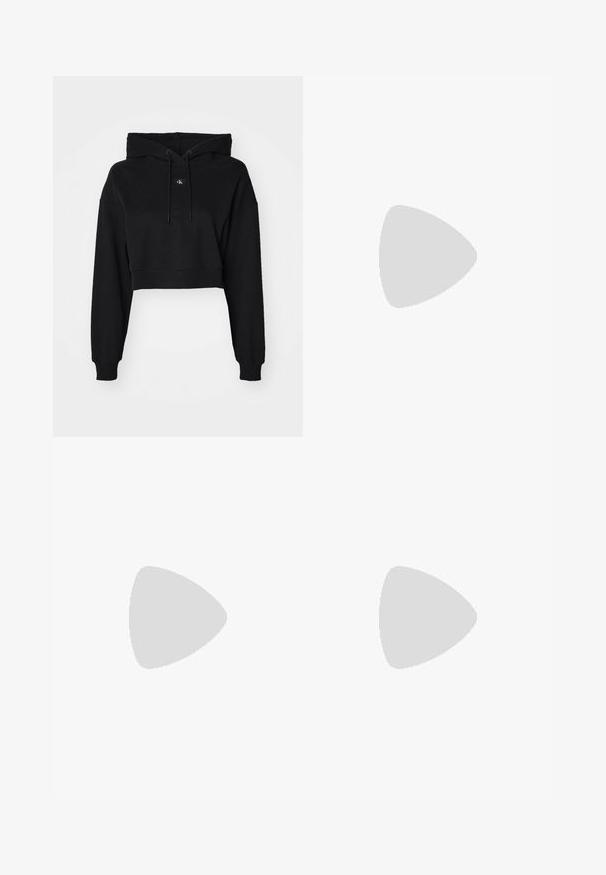 Black cropped hoodie with long sleeves, drawstring hood, soft cotton material, and a subtle logo in the center. Classic ribbed cuffs.; Black tailored trousers with a straight-leg design, featuring a smooth texture and crisp creases along the front. No visible hardware.; Beige block-heeled sandals with thin straps and a square toe. Smooth material with minimal detailing, designed for easy wear.; Black leather handbag with a structured design, featuring a cropped shape, top handle, and gold hardware accent. Adjustable shoulder strap included.