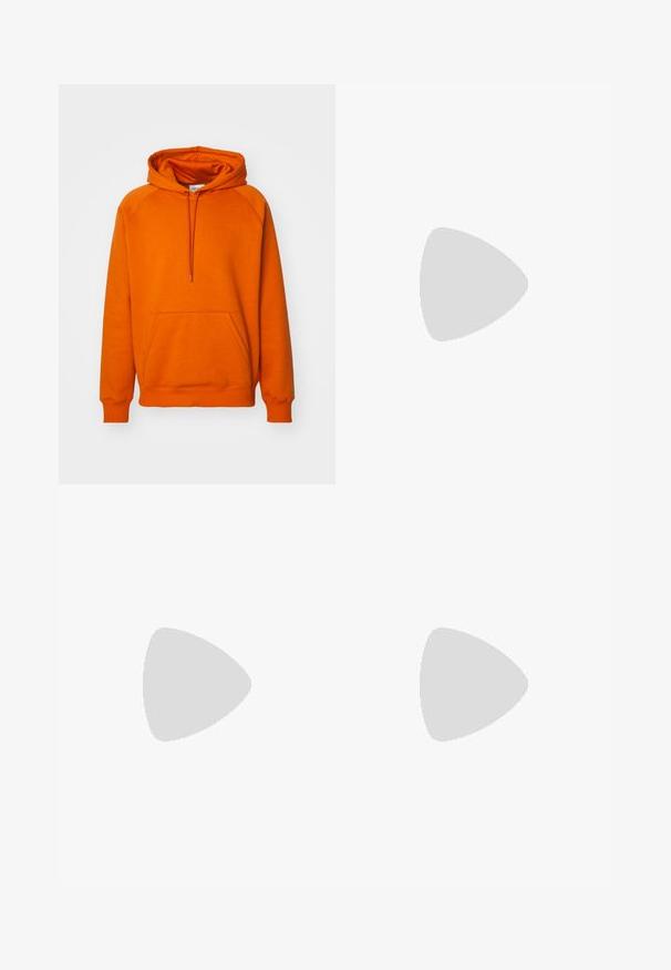 Orange hoodie with a front kangaroo pocket, drawstring hood, and ribbed cuffs. Made of soft fabric with a smooth texture.; White cotton t-shirt with short sleeves, featuring a black printed design that reads "OFFICIAL USE ONLY" alongside the Nike logo on the left side.; Light beige wide-leg pants made of cotton. Features front pockets and a button closure. Smooth texture with subtle vertical lines.; White leather sneakers with green Nike logo, round toe, flat sole, paired with light blue denim pants, shown on a blue carpet.