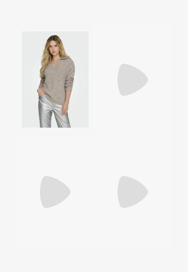 Pullovertrui in lichtbeige met een V-hals en opgerolde mouwen, gemaakt van een gestructureerd breimateriaal. Gecombineerd met glanzende zilveren broeken.; Witte geribbelde tanktop met een ronde hals, zonder mouwen en een cropped lengte. Label draagt "JJXX." Gladde stoftextuur.; Zwarte, wijde broek met een elastische tailleband, gemaakt van gladde stof. Heeft een strakke uitstraling zonder zakken of zichtbare stikseldetails.; Zwarte en grijze suède sneaker met een groot crèmekleurig "N"-logo, paarse veters en een gestructureerde rubberen zool van gum.