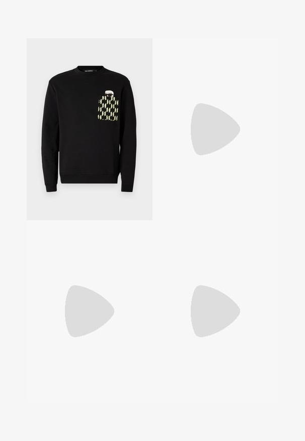 Sort sweatshirt med rund hals, der har en lomme med et gult og sort geometrisk mønster samt et trykt grafisk motiv på lommen.; Sorte skræddersyede bukser med lige pasform, fremstillet af glat stof. Har bæltestropper og foldedetalje foran.; Hvide lædersneakers med en glat finish, rund tå, flade snørebånd og en struktureret sål. Grå ruskindsdetalje ved hælen.; Klare plastik solbriller med rektangulære brune linser, med tynde, transparente stænger og metal accenter på templerne.