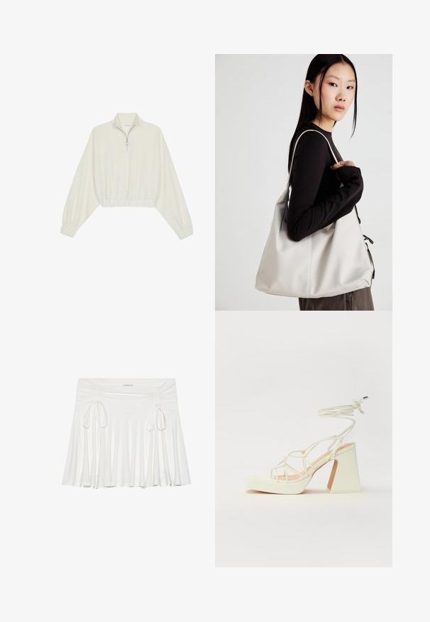 Pullover court en tissu crème, avec un col haut, fermeture éclair à mi-hauteur, ourlet et poignets élastiqués, offrant une texture lisse et un design minimaliste.; Jupe évasée blanche en tissu doux, avec des détails froncés sur les côtés et des liens ajustables, créant une silhouette fluide.; Sandale blanche à talons hauts avec un talon épais, présentant un design à lanières et un lien autour de la cheville. Texture lisse avec une plateforme à l'avant pour une hauteur supplémentaire.; Sac à main beige en matériau souple, avec un design décontracté, des détails cousus et deux poignées. Idéal pour un usage quotidien.