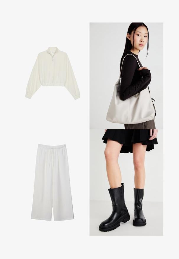 Avkortad tröja i krämfärgad tyg, med hög krage, halvdragkedja, elastisk nederkant och ärmar, med en slät yta och minimalistisk design.; Vita vida byxor i lätt tyg med elastisk midja och dragsko för justerbar passform. Mjuk textur.; Svarta läderankelstövlar med en kraftig sula, som har en slät yta, sidostickningar och en dragflik högst upp för enkel påtagning.; Beige handväska tillverkad av mjukt material, med en avslappnad design, sydda detaljer och två axelremmar. Lämplig för dagligt bruk.