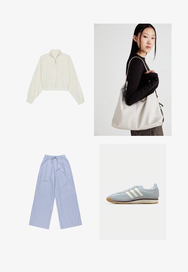 Pullover curto em tecido creme, apresentando um colarinho alto, fecho de meio zíper, bainha e punhos elásticos, com uma textura suave e design minimalista.; Calças largas azuis listradas com riscas verticais vermelhas, feitas de um tecido leve, com um cós elástico com cordão e bolsos laterais.; Sneakers de camurça azul claro com três riscas brancas, sola de borracha e malha texturizada. Apresenta uma biqueira lisa e marca no calcanhar.; Uma bolsa bege feita de material macio, com um design descontraído, detalhes de costura e duas alças para o ombro. Adequada para uso diário.