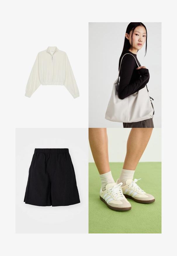 Cropped pullover in cream fabric, featuring a high collar, half-zip closure, elasticated hem and cuffs, with a smooth texture and minimal design.; Black shorts made of textured fabric with a ribbed pattern. Features an elastic waistband and relaxed fit. Ends just above the knee.; Samba sneakers with a cream and beige color scheme, featuring three light blue stripes, white laces, and brown rubber soles.; Beige handbag made of soft material, featuring a slouchy design, stitched detailing, and two shoulder straps. Suitable for everyday use.