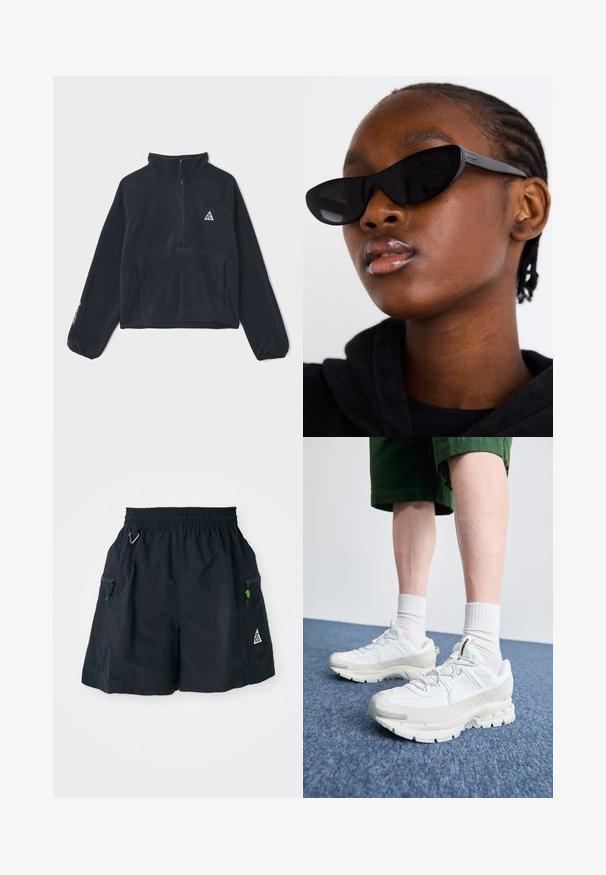 Juodas poliarinis megztinis su puse užtrauktuko apykakle, ilgomis raglan rankovėmis, dviem priekinėmis kišenėmis ir trikampiu logotipu ant kairiojo krūtinės.; Juodi šortai iš lengvos medžiagos, su elastinga juosmena, šoninėmis kišenėmis su užtrauktukais ir trikampio logotipu apatinėje dalyje.; Baltos sportinės bateliai su tekstūruotais uždengimais, masyviu padu ir pilkais akcentais. Dėvimi su baltais trumpais kojiniais ir žaliais šortais mėlyname paviršiuje.; Juodi katės akies akiniai su matinio paviršiaus apdaila, pasižymintys elegantišku dizainu ir švelniai išlenktais kraštais, derinami su modelio tamsiais drabužiais.