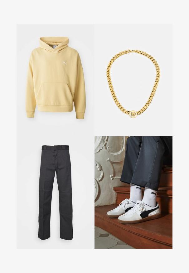 Gelbe Kapuzenjacke aus weichem Stoff, mit einer vorderen Kängurutasche und einem weißen Logo auf der Brust. Mit einer Kordelzugkapuze.; Schwarze Hose aus strapazierfähigem Material, mit geradem Bein, einem Bund mit Gürtelschlaufen und Nähten für zusätzlichen Textur.; Puma-Sneaker aus weißem und schwarzem Wildleder mit einer braunen Gummisohle. Kombiniert mit weißen Socken, die ein schwarzes Logo zeigen, getragen zu dunklen Hosen.; Goldene Kettenhalskette mit großen miteinander verbundenen Gliedern, mit einem kreisförmigen Anhänger in der Mitte, der ein erhabenes Emblem zeigt.