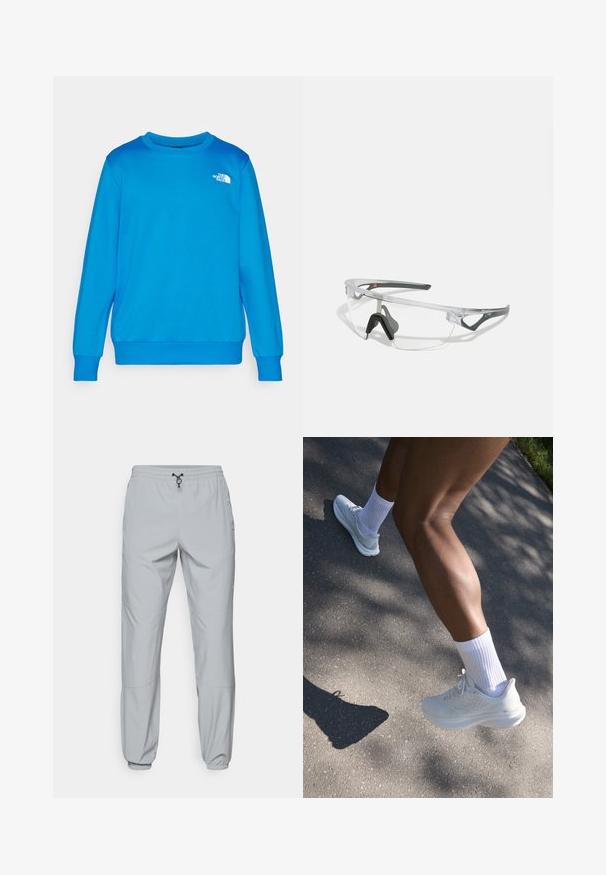 Világoskék pulóver, kerek nyakkal és hosszú ujjakkal. Bal mellen egy kis fehér logó található. Puha anyag, sima tapintású.; The North Face WIND PANT - Szabadtéri nadrágok - monument grey; Fehér sportcipő texturált felsőrésszel, fűzőkkel és párnázott talppal, fehér bokazoknival párosítva, szürke járda háttérben.; Áttetsző, könnyű keretes biztonsági szemüveg szürke kiegészítőkkel. Wraparound kialakítással és állítható orrnyereggel rendelkezik.