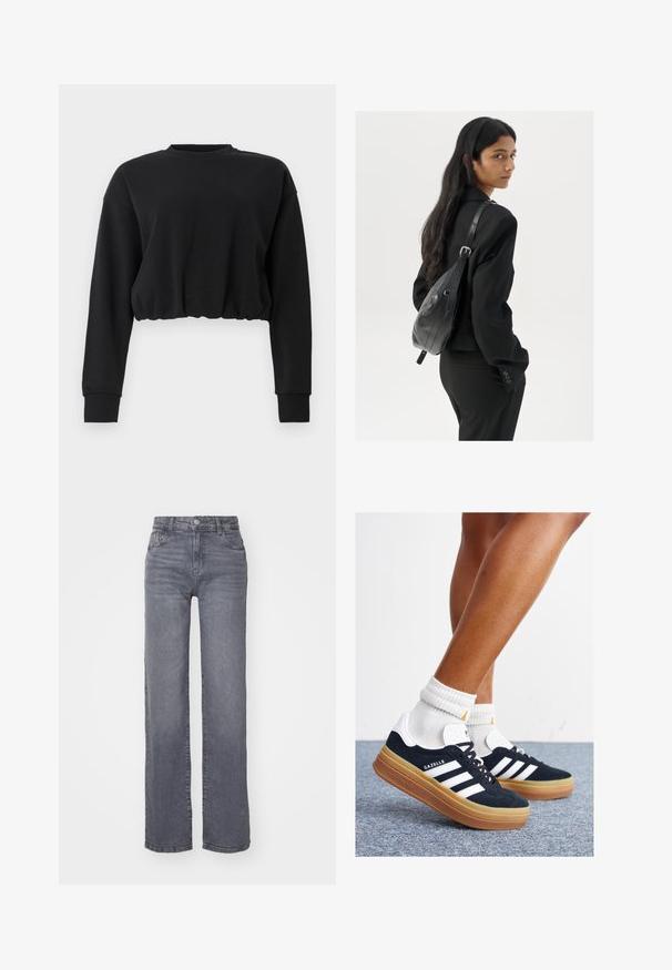 Sweatshirt cropped preto feito de tecido suave. Apresenta mangas longas, um decote redondo e uma bainha franzida para um ajuste descontraído. Design simples.; Jeans largos cinzentos feitos de denim com uma textura suave, apresentando um fecho de botão e zipper, e cinco bolsos.; Ténis de camurça preta com riscas e detalhes brancos, biqueira arredondada, sola em borracha cor de goma, combinados com meias brancas caneladas até à altura do tornozelo.; Mulher com cabelo longo e escuro, vestindo um fato preto, carregando uma mala de ombro em pele preta, olhando por cima do ombro contra um fundo branco.