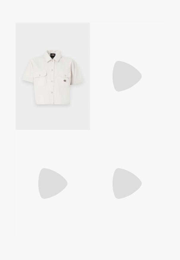 Short-sleeve, cropped white shirt made of cotton with two chest pockets, button-down front, and a logo patch on the left pocket.; Light blue denim pencil skirt with a front slit, high waist, belt loops, and classic five-pocket design. Faded texture enhances appearance.; White and beige Nike sneakers with perforated design, black swoosh logo, textured upper, and distinctive springy black heel.; Crocheted tote bag in beige with a floral pattern, featuring yellow accents. Two sturdy handles for carrying, soft texture, and open design.